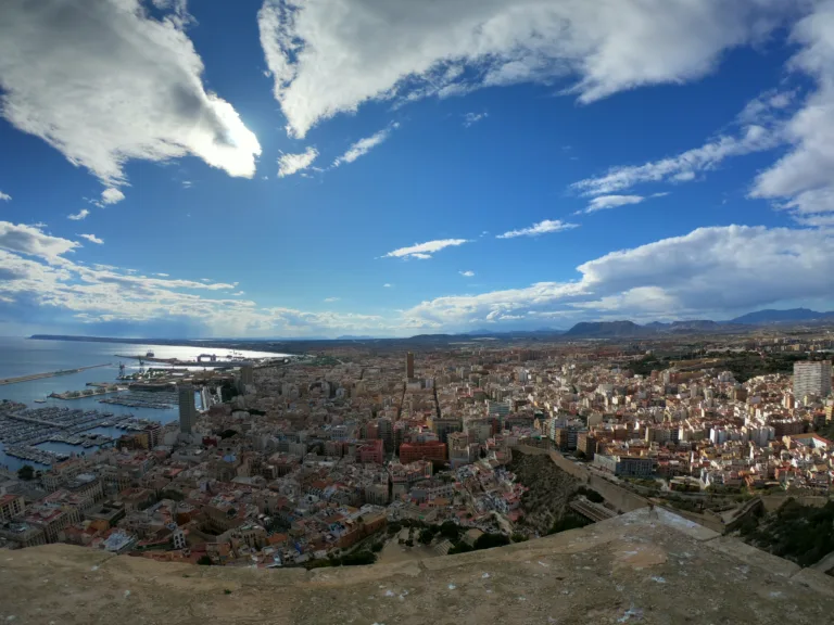 Aerial view of Alicante rooftops, port and Mediterranean coast from Santa Bárbara Castle